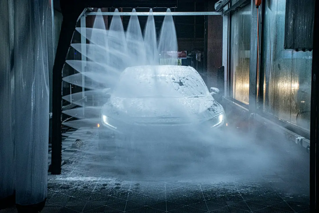 Car under a curtain of water jets