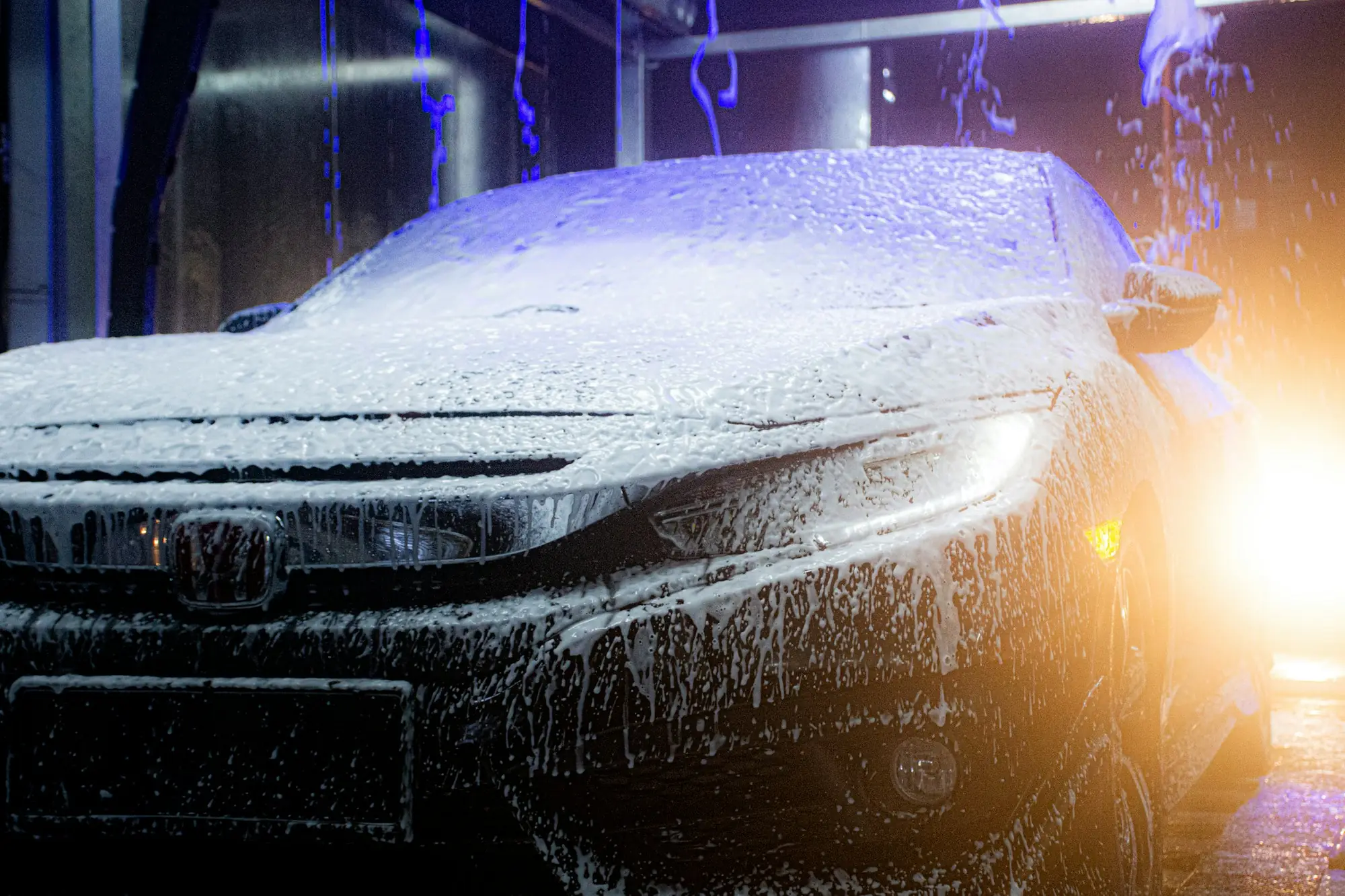 Car covered in snow foam